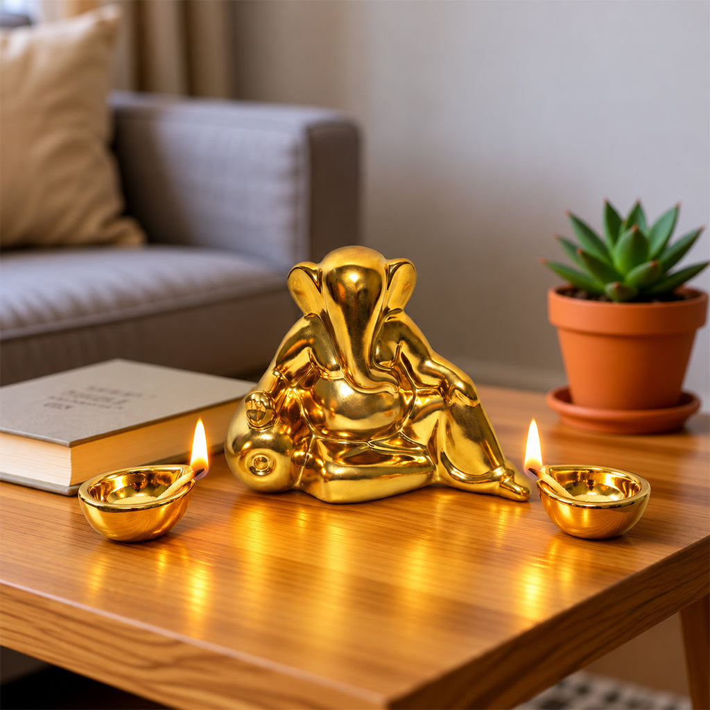 Ceramic Lord Ganesh Idol with Two diyas in Gold Finish
